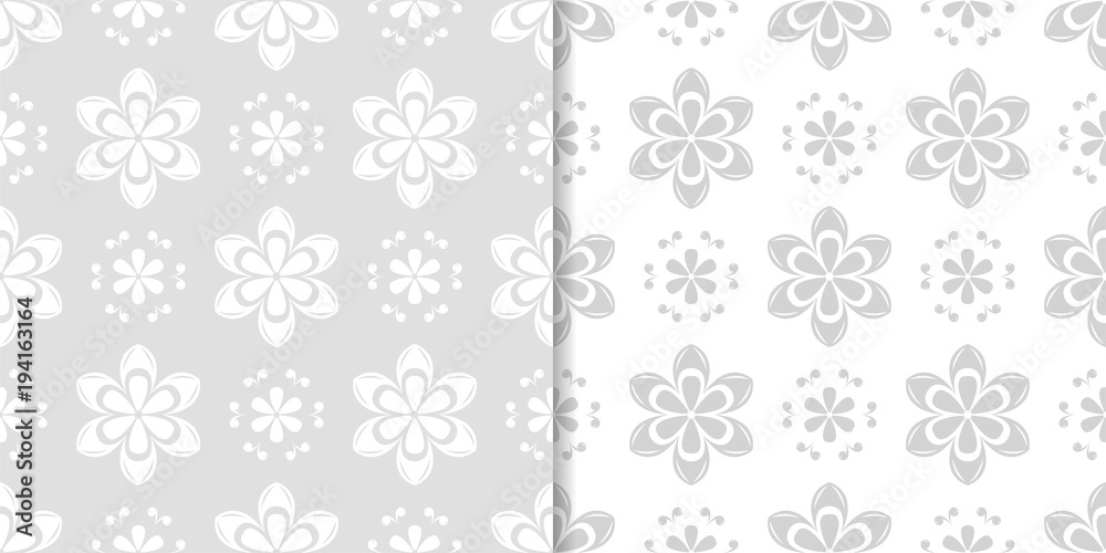 Light gray floral backgrounds. Set of seamless patterns Light gray floral backgrounds. Set of seamless patterns