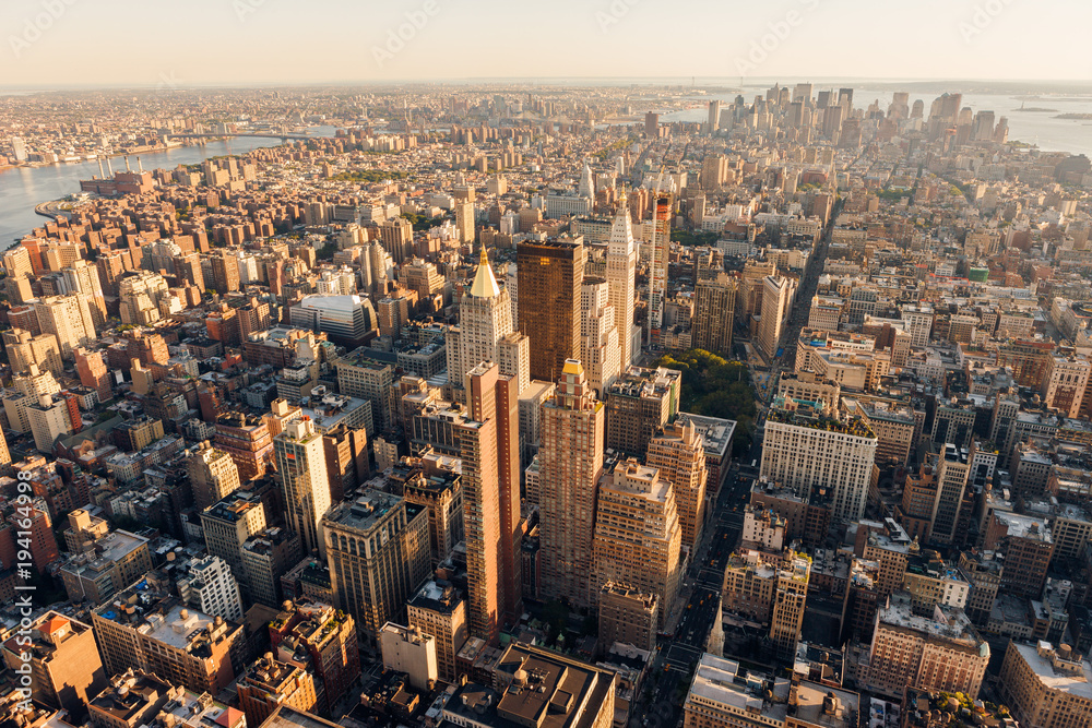 Aerial view at sunset of Manhattan below 30th Street (along 5th Avenue) including Midtown, Flatiron District, Chelsea, East Village, Lower Manhattan and the Financial District