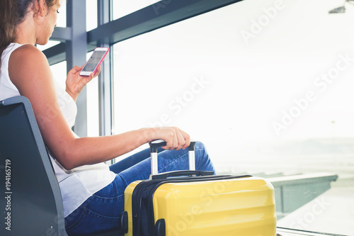Photography Closeup woman carries your luggage at the airport terminal