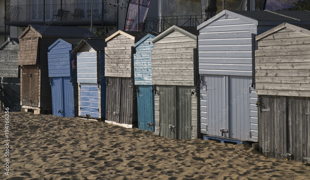 Fototapeta premium Beach huts at sunset