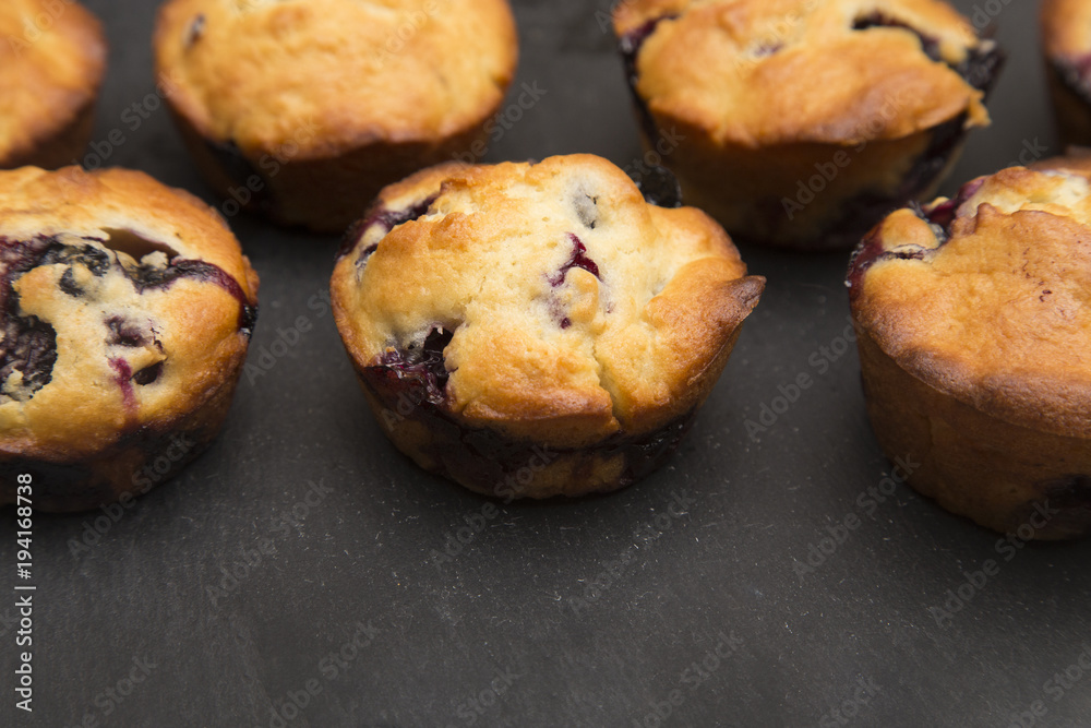 Homemade Blueberry Muffins on a Slate Board Homemade Blueberry Muffins on a Slate Board