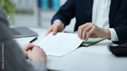 Business people signing a contract