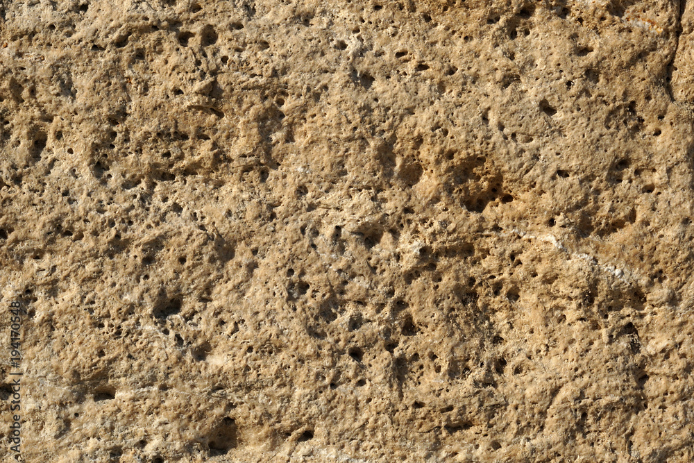 Texture background of old natural stone brick wall in yellow with joint and rough surface, Old Bazar in Skopje Texture background of old natural stone brick wall in yellow with joint and rough surface, Old Bazar in Skopje