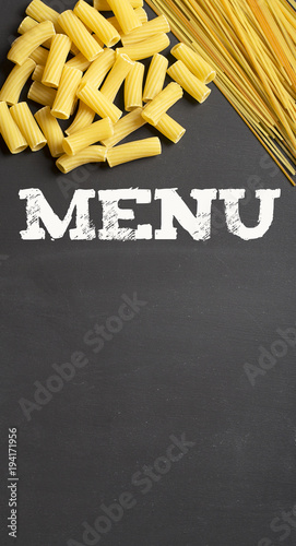 Background with pasta and copy space with the word Menu on top. Copy space. Conceptual.