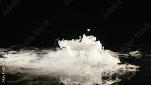 Boiling dry ice in a water with dense vapor