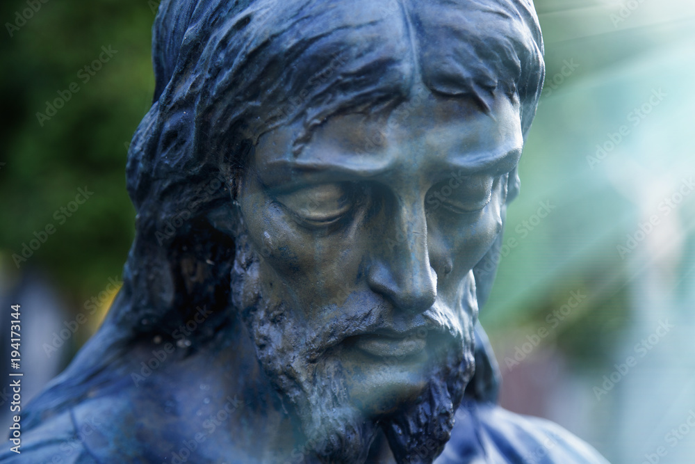 Statue of sad Jesus Christ (religion, faith, death, resurrection, eternity concept)
