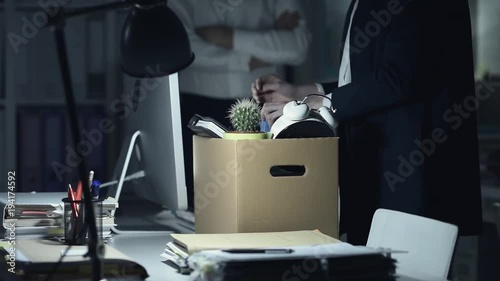 Fired employee packing her belongings