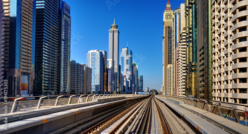 Metro on the background of skyscrapers of Dubai World Trade center