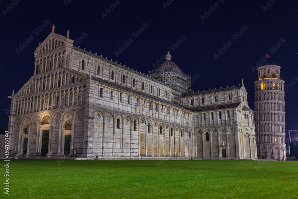 Night view of Leaning Tower of Pisa (Torre di Pisa) and Cathedral on Piazza dei Miracoli in Pisa, Tuscany, Italy.