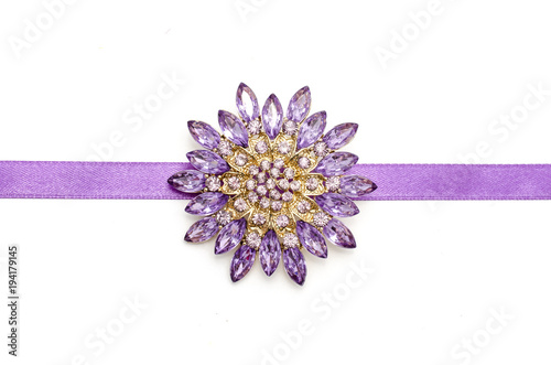 round brooch flower isolated on silk ribbon