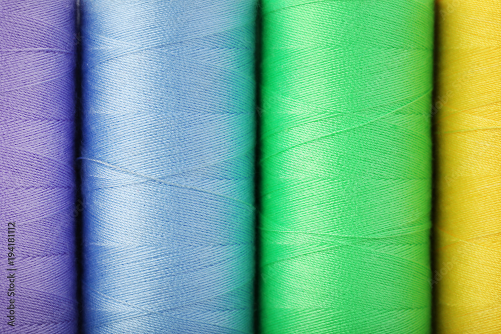 Background of colourful thread spools Background of colourful thread spools