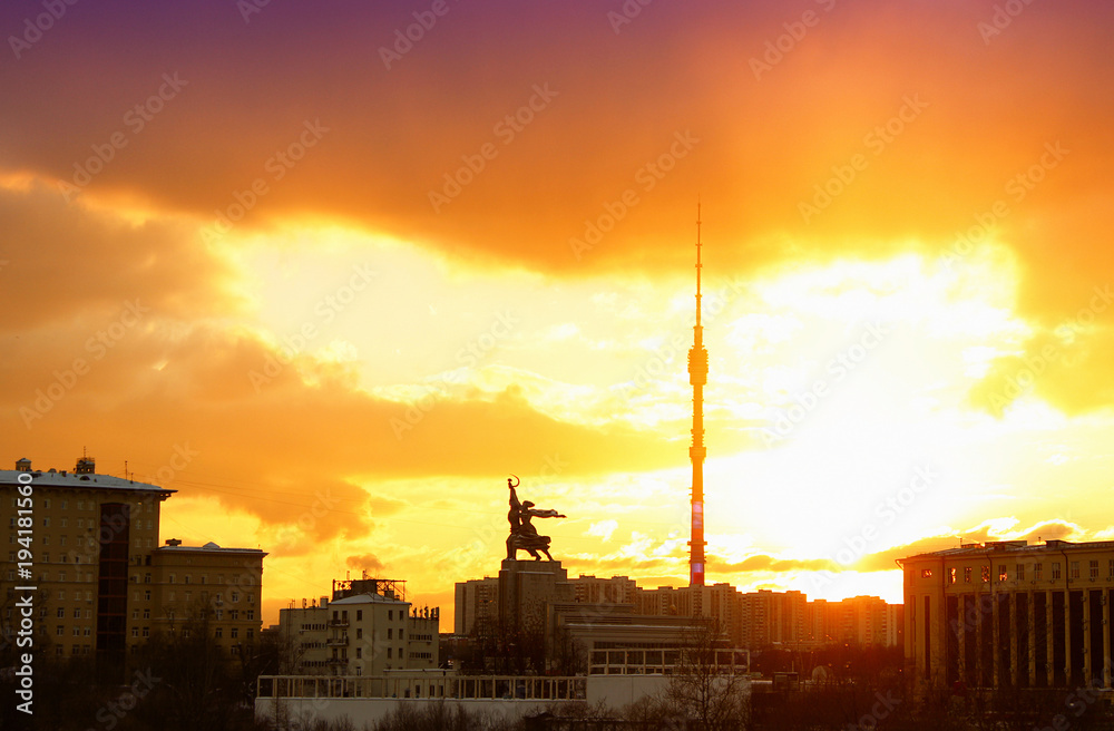 Architectural monument A worker and a collective farmer with the Ostankino tower at sunset. Moscow, Russia