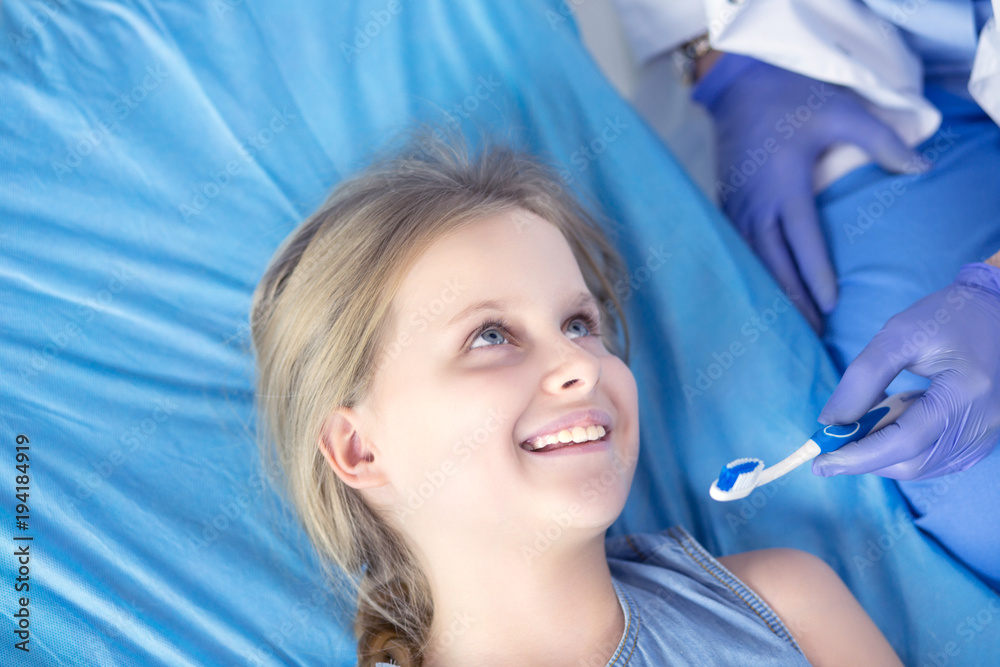 Little girl sitting in the dentists office Little girl sitting in the dentists office