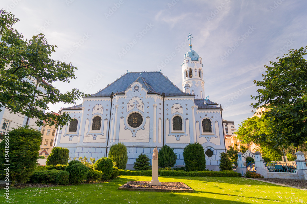 The blue church in Bratislava. Saint Elizabeth church view from the side trough the park.