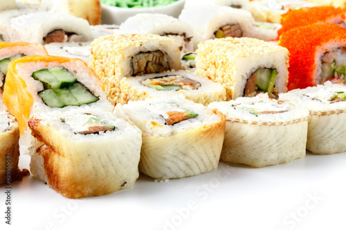 close-up shot of traditional fresh japanese sushi rolls, focus on the front piece