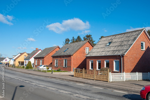 houses near the road in town of Hoeng in Denmark