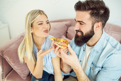 Couple sharing pizza