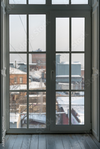 large French window overlooking the winter city
