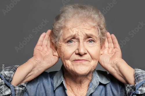 Elderly woman with hearing ...