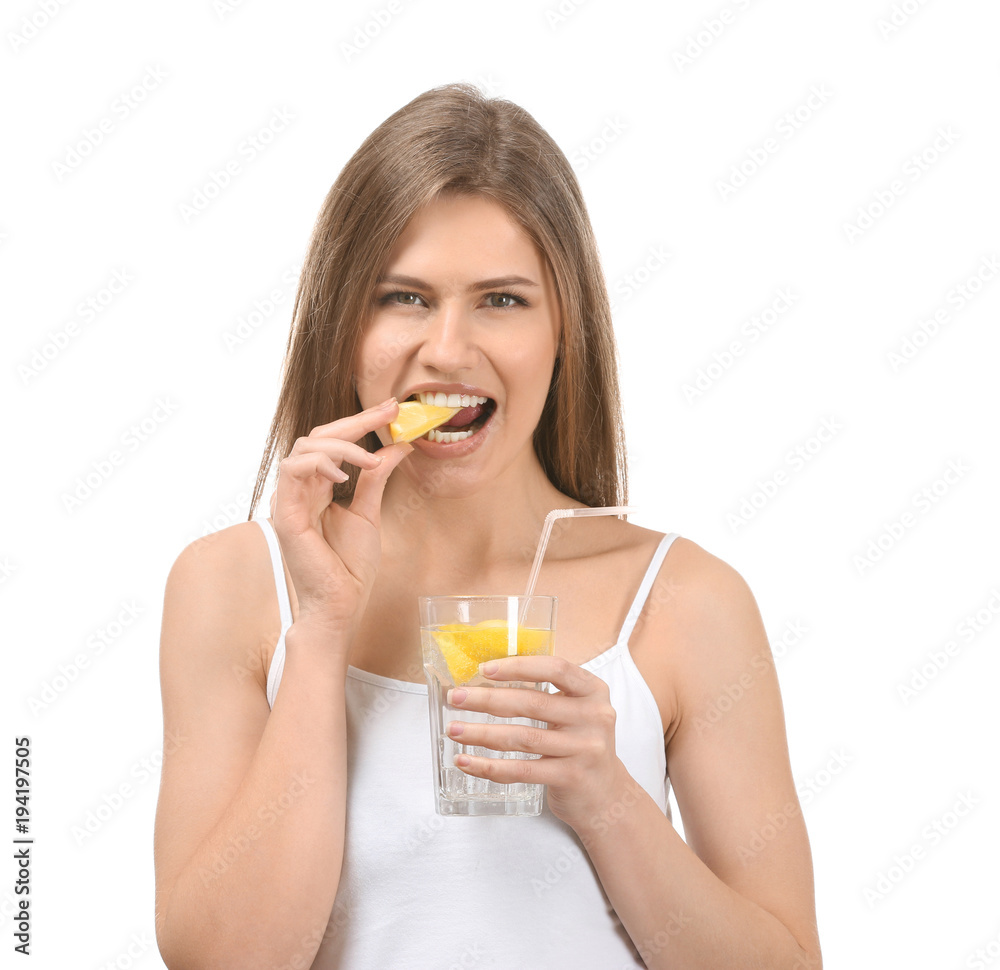Beautiful young woman with glass of lemonade on white background Beautiful young woman with glass of lemonade on white background
