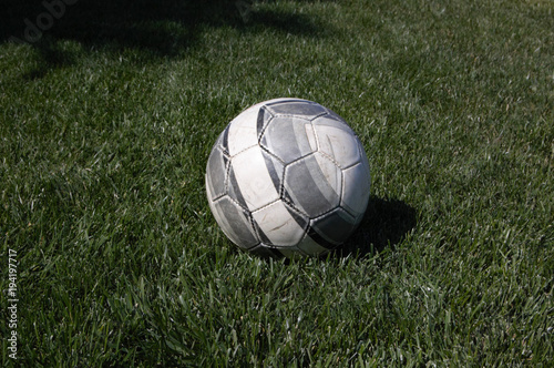 Soccer ball lying in the grass © Blake