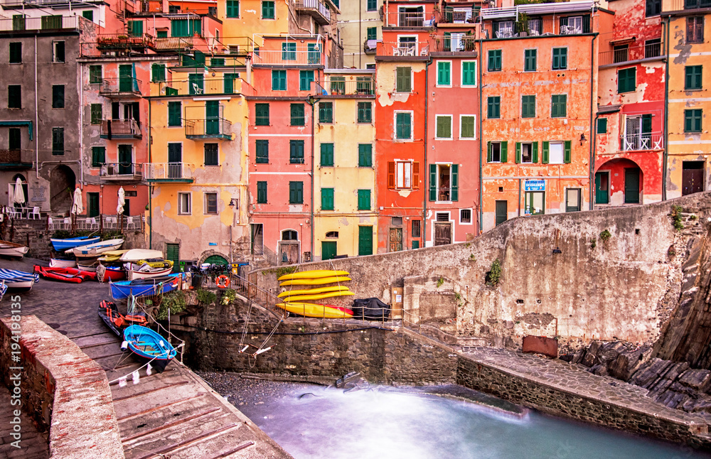 View on the colorful houses along the coastline of Cinque Terre area in Riomaggiore