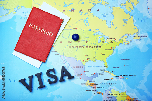 Passport and word VISA on map
