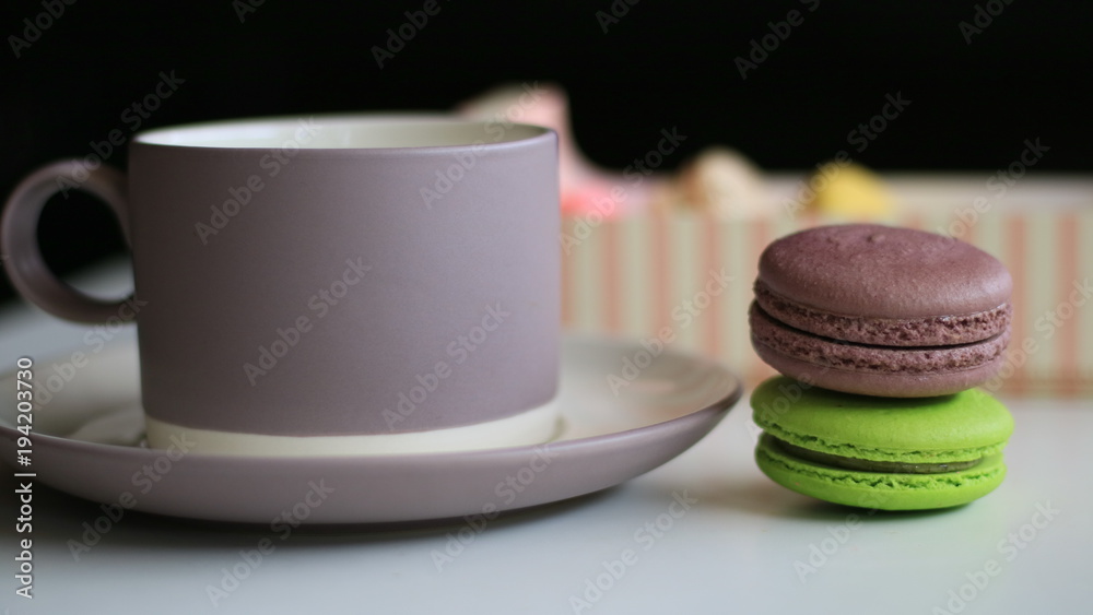 Obraz premium Chocolate macron and a cup of drink.
