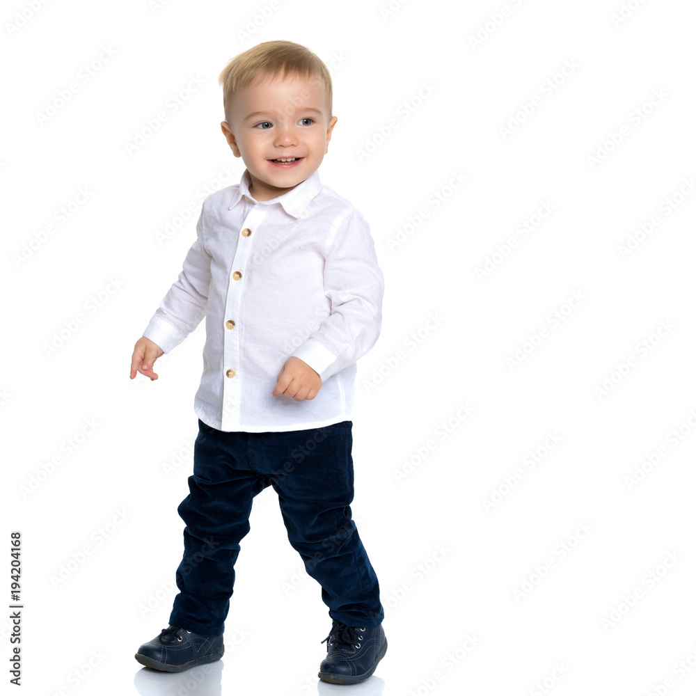 The little boy is emotionally waving his arms. The little boy is emotionally waving his arms.