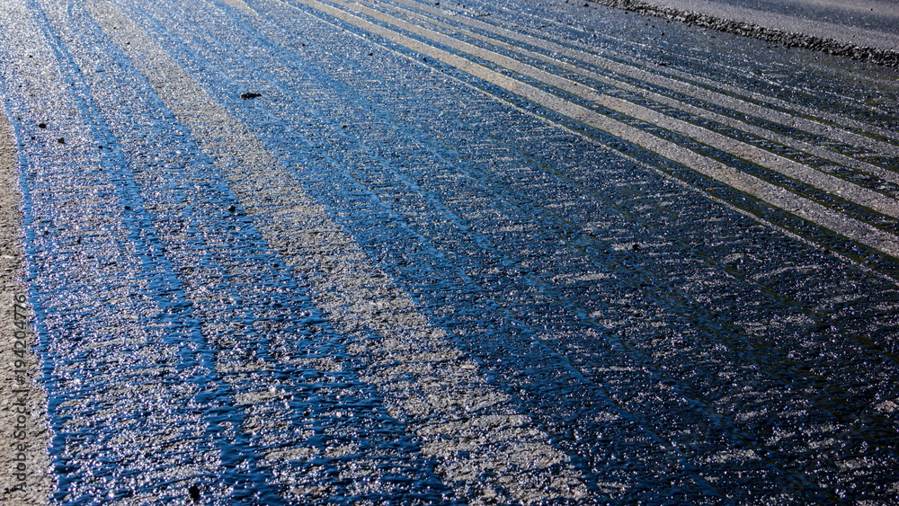 Obraz premium Traces of bitumen on the pavement