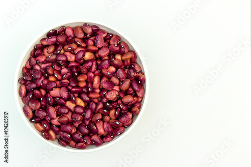 kidney bean in white tableware on a white background