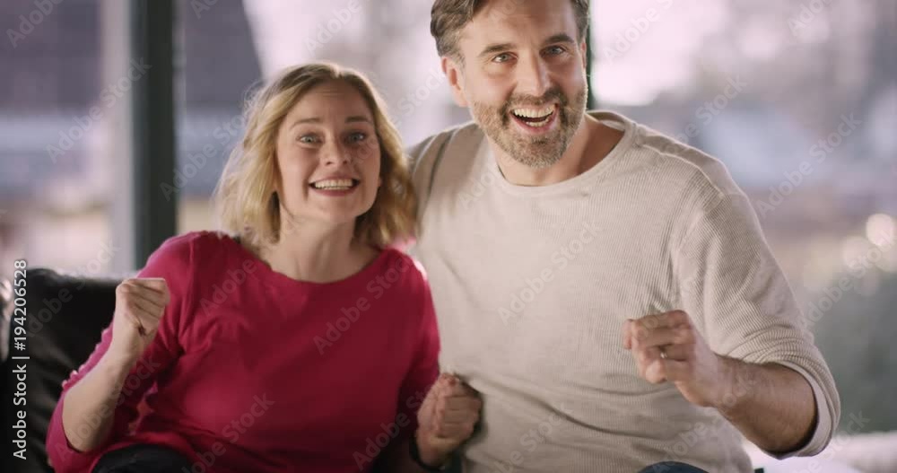 Couple watching TV and celebrating Couple watching TV and celebrating