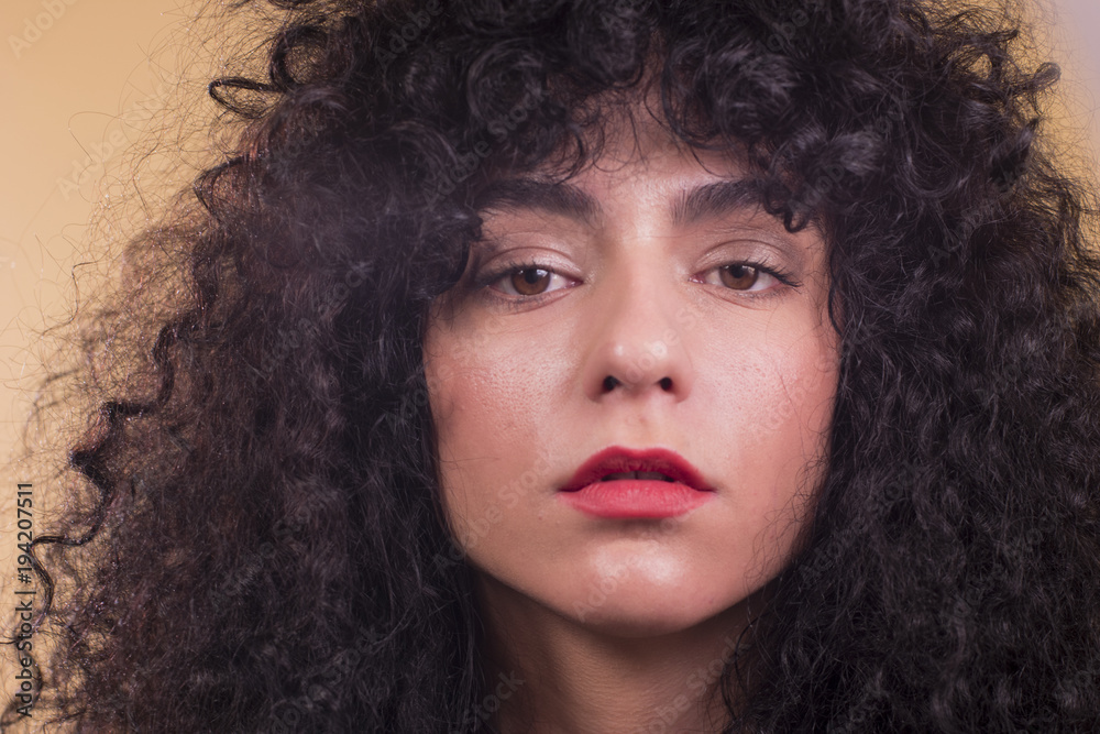 Curly woman in studio Curly woman in studio