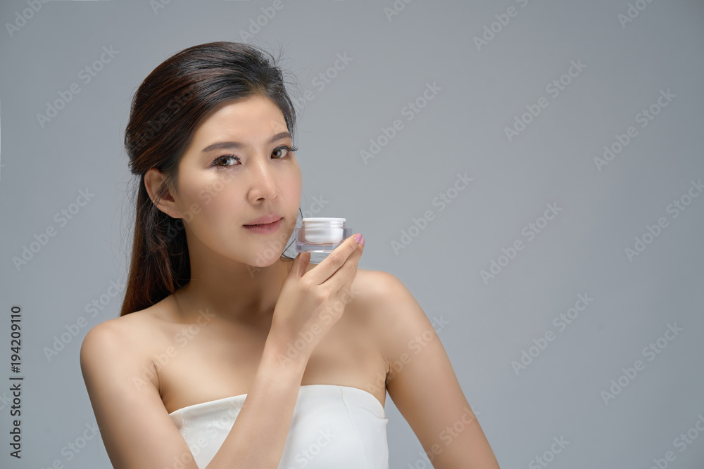 Happy beautiful asian girl with the fresh skin on white background. Expressive facial expressions. Cosmetology and Spa concept. Happy beautiful asian girl with the fresh skin on white background. Expressive facial expressions. Cosmetology and Spa concept.