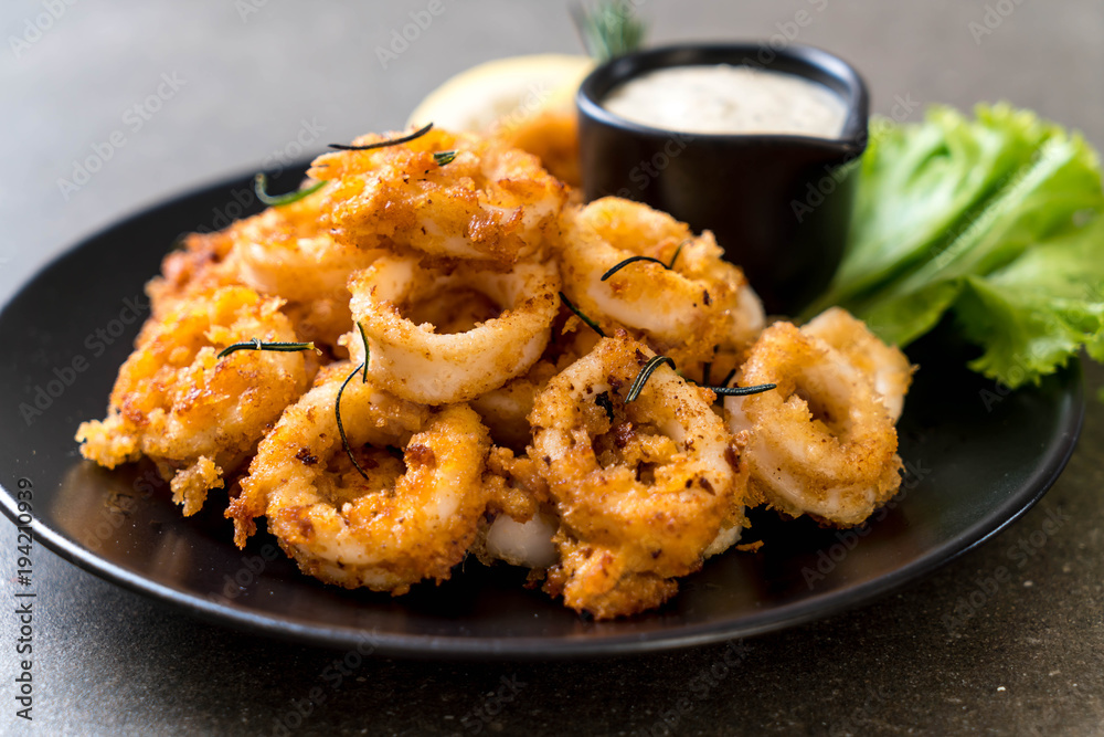 fried squids or octopus (calamari) with sauce fried squids or octopus (calamari) with sauce