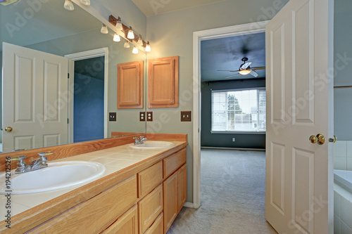Master Bathroom suite features light wood vanity cabinet