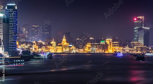 Shanghai at night. Located in The Bund (Waitan). It is a waterfront area in central Shanghai, one of the most famous tourist destinations in Shanghai, China. photo