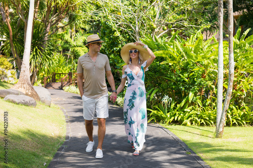 Couple walking on vacation in tropical resort