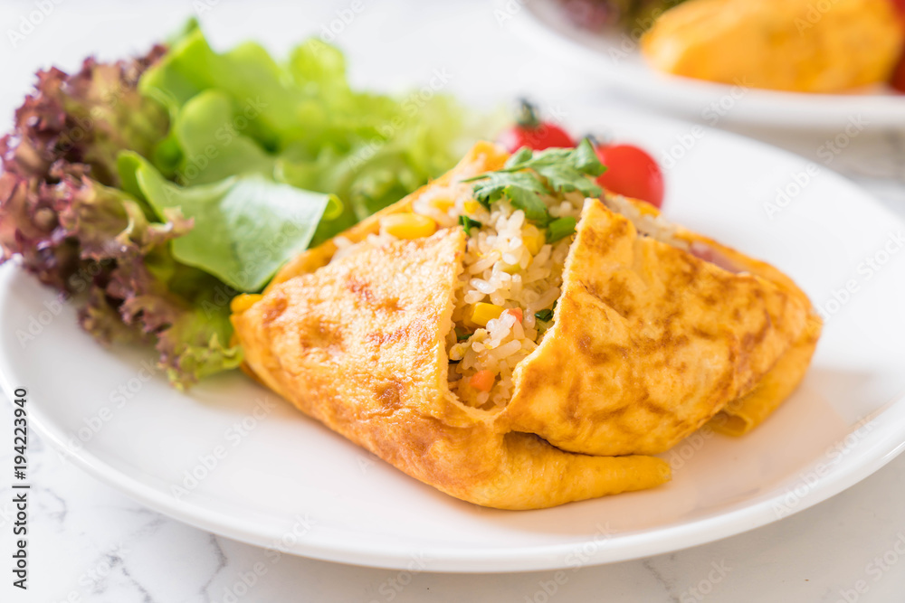 Flavored Fried Rice in an Omelet Wrapping Flavored Fried Rice in an Omelet Wrapping