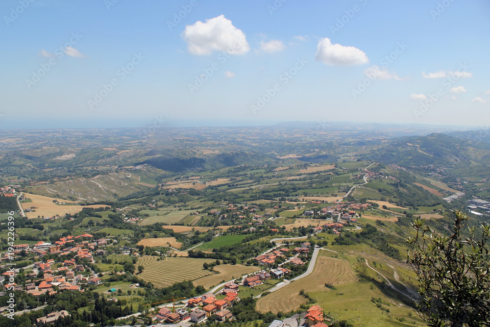 Typical sunny summer landscape of rural northern Italy from height of bird's flight.