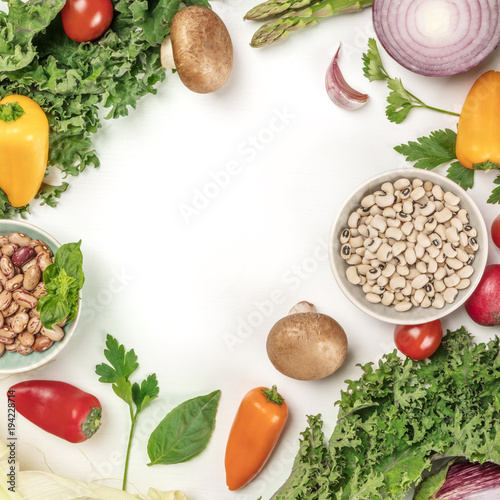 Vibrant fresh vegetables, cereals, and mushrooms on white background with copyspace, square photo