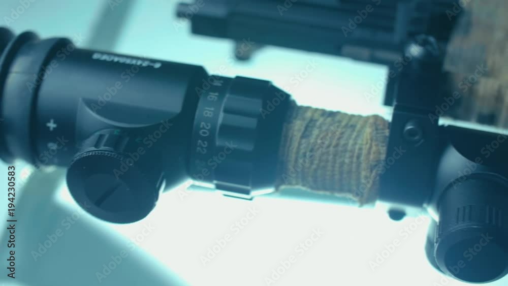 Closeup of a sniper rifle telescope glass lens CSI Closeup of a sniper rifle telescope glass lens CSI