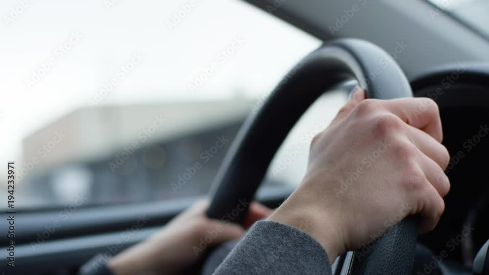 Closeup Of Woman's Hands On Steering Wheel, As She Drives Downtown - Shot On Red Scarlet-W Dragon In 4K/ Slow Motion Closeup Of Woman's Hands On Steering Wheel, As She Drives Downtown - Shot On Red Scarlet-W Dragon In 4K/ Slow Motion