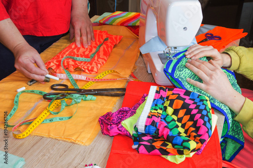 Close-up of woman's hand stitching quilting. Tailor Woman working in his tailor shop, Tailoring. tailoring concept photo