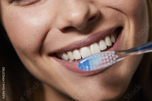 Perfect smile with toothbrush, close up