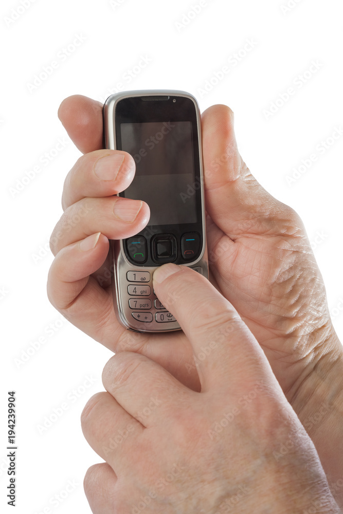 Hands of old man with old mobile phone Hands of old man with old mobile phone