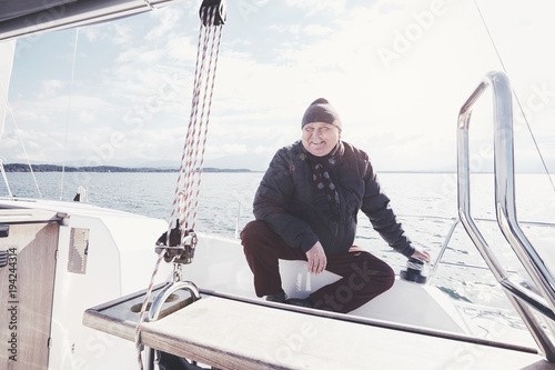 Aged man on sailboat