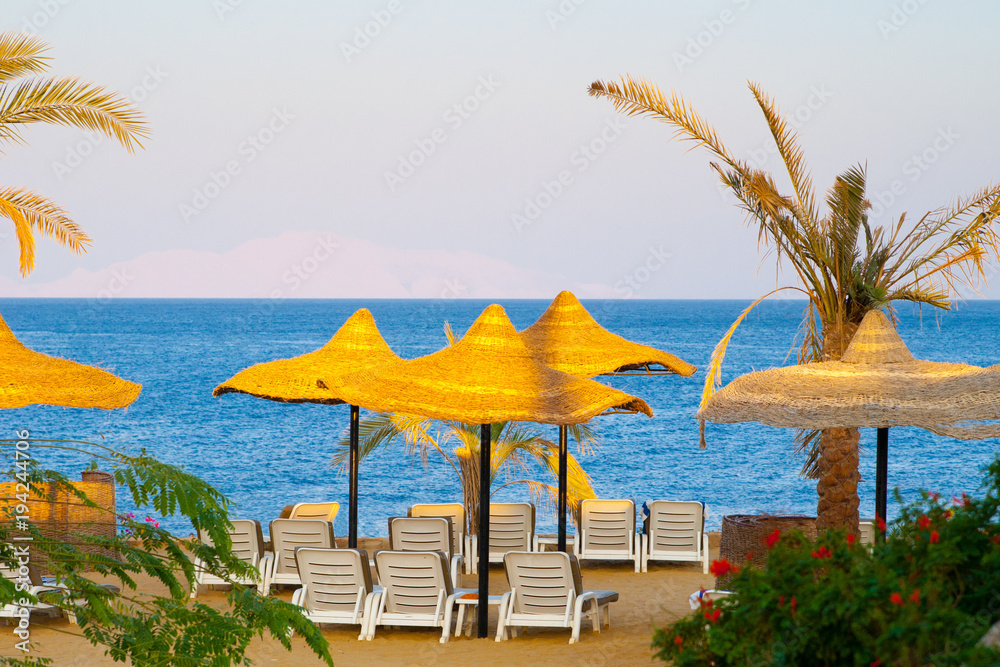 resort sea view with parasols and deck chair