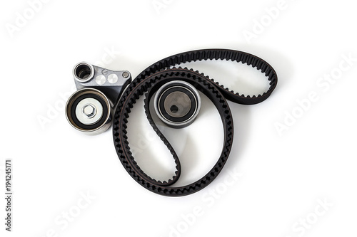 Fotografie Kit of timing belt with rollers on a white background isolated