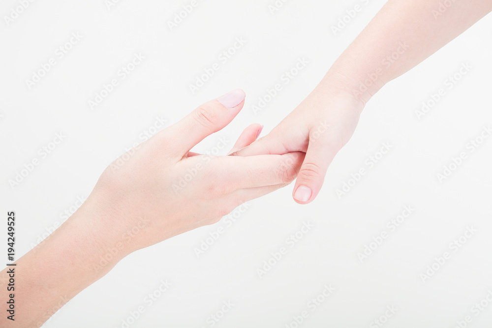 Kid hand on mother's hand isolated on white background